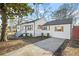 This charming home has new siding, updated windows with shutters, and a freshly sealed driveway at 1092 Donnelly Sw Ave, Atlanta, GA 30310