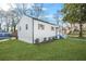 View of a home with recently updated white siding and a well manicured lawn at 1092 Donnelly Sw Ave, Atlanta, GA 30310