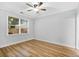 Bright bedroom with hardwood floors, neutral walls, and a large window with natural light at 1283 Mercer, East Point, GA 30344