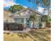 Charming bungalow with a blue door, manicured landscaping, and inviting front porch at 1283 Mercer, East Point, GA 30344