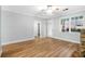 Light-filled living room showcasing hardwood floors, a stone fireplace, and a doorway at 1283 Mercer, East Point, GA 30344
