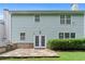 The house's backyard has a stone patio with a built-in grill and ample green space at 1609 Vinery Se Ln, Mableton, GA 30126