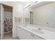 Bathroom with double sink vanity, large mirror, and separate room with shower/toilet at 1609 Vinery Se Ln, Mableton, GA 30126