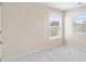 Well-lit bedroom with neutral walls and carpet, offering a blank canvas for personal style at 1609 Vinery Se Ln, Mableton, GA 30126