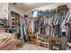 Spacious walk-in closet featuring ample shelving and hanging storage for all your wardrobe needs at 1609 Vinery Se Ln, Mableton, GA 30126