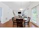 Bright dining area with hardwood floors, a round wooden table, and view of living room at 1609 Vinery Se Ln, Mableton, GA 30126