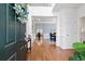Bright foyer with hardwood floors, wainscoting, and a view into the dining room at 1609 Vinery Se Ln, Mableton, GA 30126