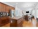 Modern kitchen featuring stainless steel appliances, center island with granite countertop, and beautiful wood floors at 1609 Vinery Se Ln, Mableton, GA 30126