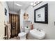 Bathroom with a rustic touch, featuring a unique shower curtain and decorative accents at 325 Harris Loop, Dallas, GA 30157