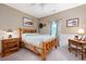 Comfortable bedroom with wooden furniture, natural light, and warm, inviting decor at 325 Harris Loop, Dallas, GA 30157