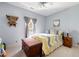 Cozy bedroom with natural light, a decorative bed, a trunk, and vintage decor at 325 Harris Loop, Dallas, GA 30157
