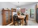 Cozy dining area with natural light, wooden table set, and decorative hutch at 325 Harris Loop, Dallas, GA 30157