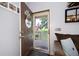 Inviting entryway showcasing a decorative welcome sign and view of the front porch at 325 Harris Loop, Dallas, GA 30157