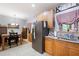 Bright kitchen with stainless steel appliances, granite countertops, and adjacent dining area at 325 Harris Loop, Dallas, GA 30157