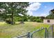 Spacious backyard with lawn, mature trees, and shed at 1191 S Burnt Hickory Rd, Douglasville, GA 30134
