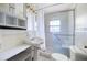 Bathroom featuring a glass shower, a white sink, and ample lighting at 1191 S Burnt Hickory Rd, Douglasville, GA 30134