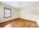 A bedroom featuring wood floors, neutral walls and a window bringing in natural light at 1191 S Burnt Hickory Rd, Douglasville, GA 30134