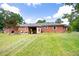 Rear exterior view of the brick home with a large, well-maintained yard at 1191 S Burnt Hickory Rd, Douglasville, GA 30134