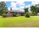 Charming brick home with a well-maintained lawn and mature trees at 1191 S Burnt Hickory Rd, Douglasville, GA 30134