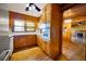 Eat-in kitchen features appliances and a view into the wood-paneled living space at 1191 S Burnt Hickory Rd, Douglasville, GA 30134