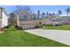 Charming two-story home with a two-car garage, covered front porch, and a well-manicured lawn at 1784 Treymire Ct, Stone Mountain, GA 30088
