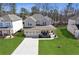 Charming home with a manicured lawn, covered front porch, and three-car garage at 1784 Treymire Ct, Stone Mountain, GA 30088