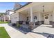 Inviting front porch with rocking chairs, stone accents, and a charming entrance at 1784 Treymire Ct, Stone Mountain, GA 30088