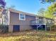 A view of the back side of the house with a small deck at 1946 Singer Way, Lithonia, GA 30058