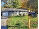 Charming single-story home with a manicured lawn and attached garage at 1946 Singer Way, Lithonia, GA 30058