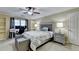 Stylish bedroom with a gray bed frame, office space, and comfortable seating at 3034 Brookgreen Trl, Lawrenceville, GA 30043