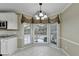 Charming breakfast nook with bright, large windows and a view of the backyard at 3034 Brookgreen Trl, Lawrenceville, GA 30043