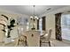 Cozy dining room with a round table, elegant chairs, and decorative chandelier at 3034 Brookgreen Trl, Lawrenceville, GA 30043