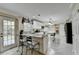 Bright kitchen with white cabinets, granite countertops, stainless steel appliances, and a breakfast bar at 3034 Brookgreen Trl, Lawrenceville, GA 30043