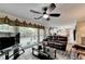 Living room featuring a view of backyard, access to kitchen, and cozy seating at 3034 Brookgreen Trl, Lawrenceville, GA 30043