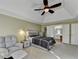 Spacious main bedroom with tray ceilings, windows, seating area, and ensuite bathroom at 3034 Brookgreen Trl, Lawrenceville, GA 30043