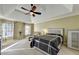 Spacious main bedroom with tray ceilings, windows, and neutral tones at 3034 Brookgreen Trl, Lawrenceville, GA 30043