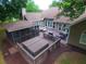 A backyard featuring a hot tub on a deck, outdoor seating, and a screened gazebo at 11940 Wexford Club Dr, Roswell, GA 30075