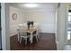 Formal dining area featuring hardwood floors, and seating for six makes for the perfect entertaining space at 11940 Wexford Club Dr, Roswell, GA 30075