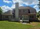 Brick exterior view showcasing backyard and deck at 1255 Home Place Dr, Lawrenceville, GA 30043
