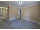Bedroom with neutral walls and carpet floors with a doorway leading to another room at 1255 Home Place Dr, Lawrenceville, GA 30043