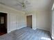 Bedroom features neutral carpet, closet, and neutral paint at 1255 Home Place Dr, Lawrenceville, GA 30043