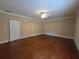 Spacious bedroom features hardwood floors and a ceiling fan at 1255 Home Place Dr, Lawrenceville, GA 30043
