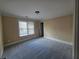 Bedroom with carpet floors and a window with blinds at 1255 Home Place Dr, Lawrenceville, GA 30043