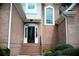 Brick home featuring a decorated front door and manicured shrubbery and front steps at 1255 Home Place Dr, Lawrenceville, GA 30043