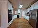 The kitchen offers granite counters, white cabinets, and stainless appliances at 1255 Home Place Dr, Lawrenceville, GA 30043