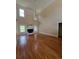 Spacious living room boasts hardwood floors, large windows, and a cozy fireplace at 1255 Home Place Dr, Lawrenceville, GA 30043