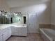 Spacious bathroom features double sinks, soaking tub, and walk-in shower at 1255 Home Place Dr, Lawrenceville, GA 30043