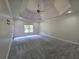 Large bedroom has a trey ceiling, neutral carpet, and large windows at 1255 Home Place Dr, Lawrenceville, GA 30043