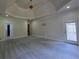 Spacious bedroom with trey ceiling, carpet, and a doorway to an outdoor patio at 1255 Home Place Dr, Lawrenceville, GA 30043