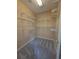 Carpeted walk-in closet has plenty of storage space with wire shelving at 1255 Home Place Dr, Lawrenceville, GA 30043